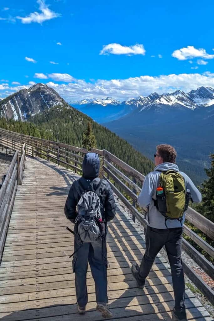 two people walking on Sanson's peak broadwalk at Sulphur mountain in Banff