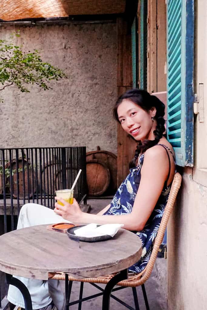 Woman sitting in a cafe in Hanoi, Vietnam.